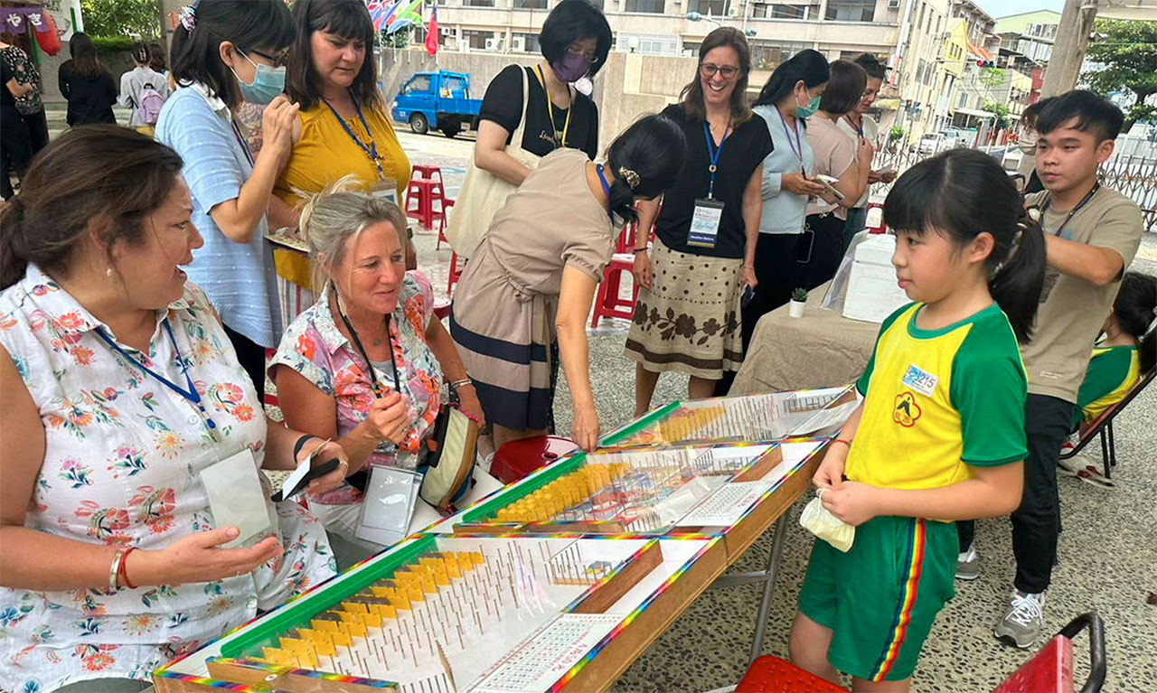 American teachers interacting with Taiwanese students